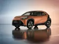 Pomarańczowa Toyota Aygo X z czarnymi dodatkami, idealna do miasta. Sprawdź atrakcyjną toyota hybryda cena.