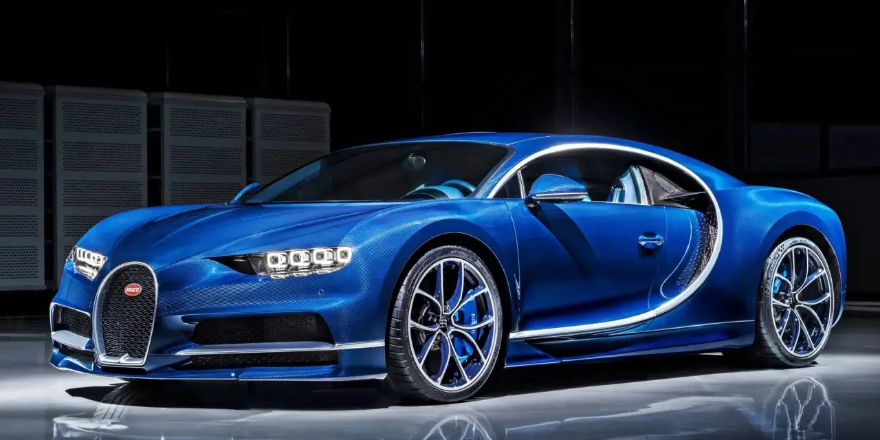 Błękitny Bugatti Chiron, symbol luksusu. Zastanawiasz się, ile kosztuje Bugatti Chiron? To marzenie wielu, ale cena jest astronomiczna.
