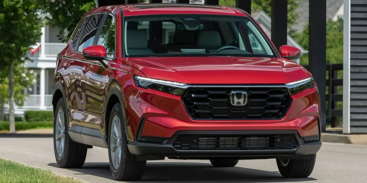 Czerwony Honda CR-V na drodze. Sprawdź aktualną honda cr-v cena i wybierz swój wymarzony SUV.