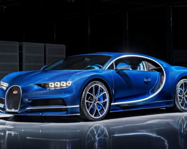Błękitny Bugatti Chiron, symbol luksusu. Zastanawiasz się, ile kosztuje Bugatti Chiron? To marzenie wielu, ale cena jest astronomiczna.